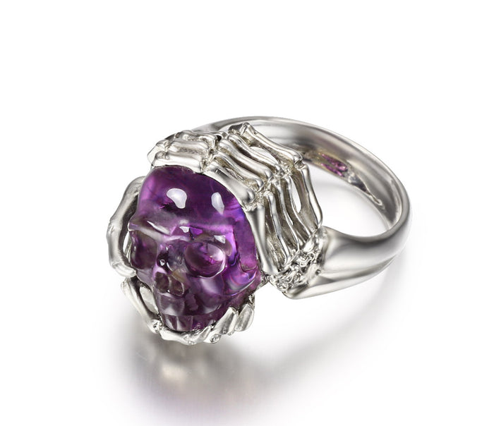 Remember Forever - Ring of Amethyst Carved Gemstone Crystal Skull in Sterling Silver Skeletal Hands